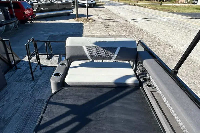 Slide: The Image of 2025 Viaggio Z22D boat interior with cushioned seating and cup holders. - 20