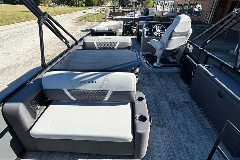 Slide: The Image of 2025 Viaggio Z22D boat interior with modern seating and steering console. - 24