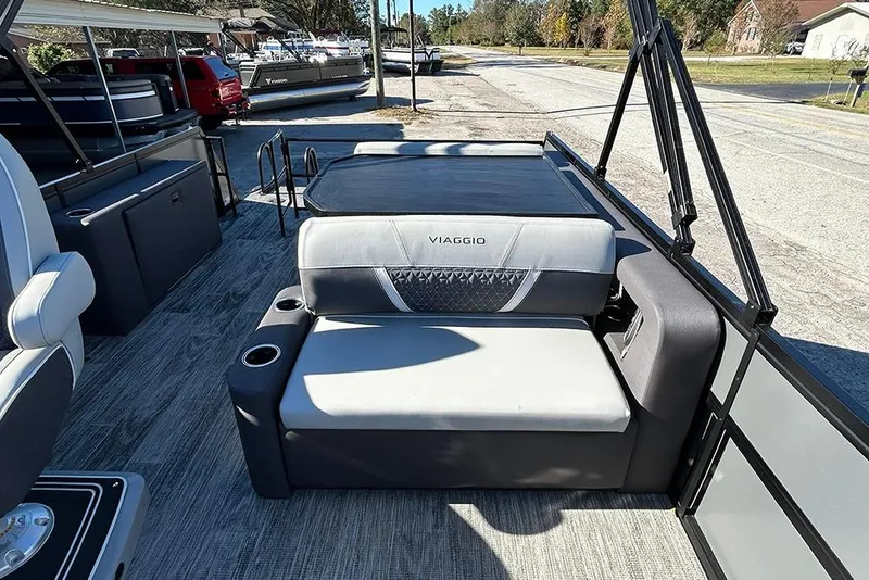 Slide: The Image of 2025 Viaggio Z22D pontoon boat interior with gray seating and cup holders. - 25