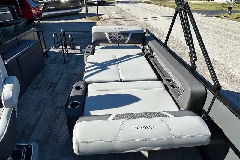 Slide: The Image of Luxurious 2025 Viaggio Z22D boat interior with plush seating and cup holders. - 28