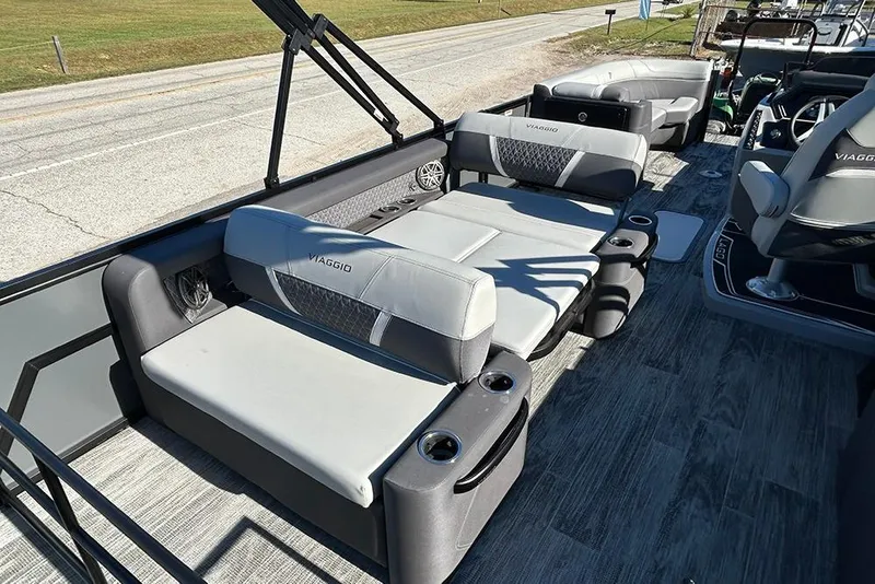 Slide: The Image of 2025 Viaggio Z22D boat interior with gray seating and cup holders. - 30