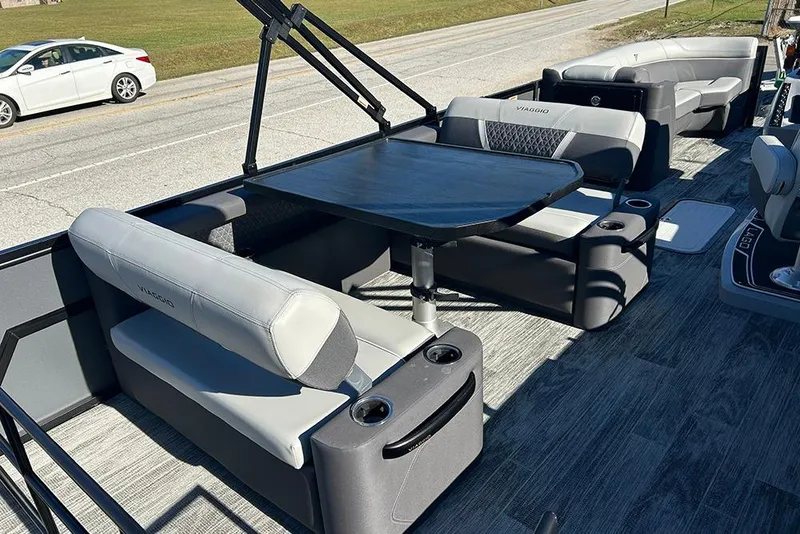 Slide: The Image of 2025 Viaggio Z22D boat interior with seating and table on a sunny day. - 31