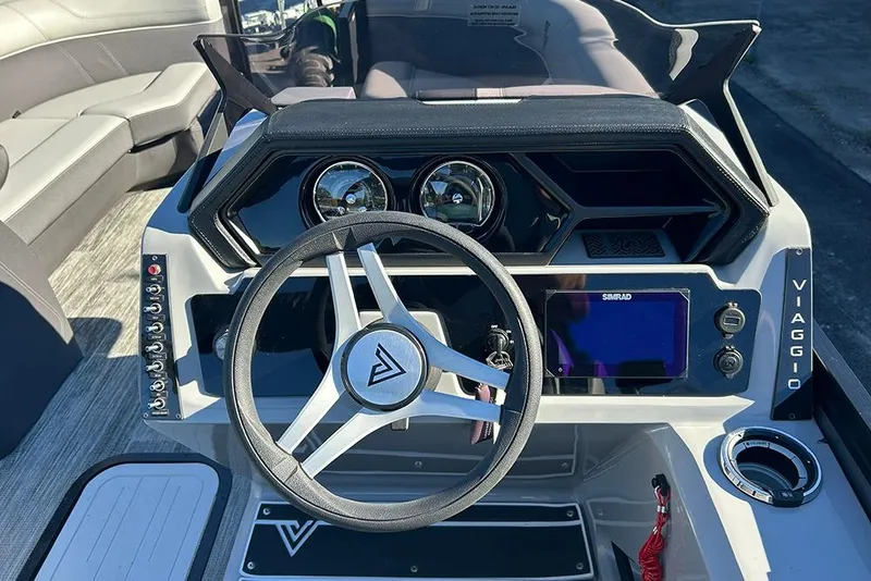 Slide: The Image of 2025 Viaggio Z22D boat dashboard with steering wheel and control panel. - 32