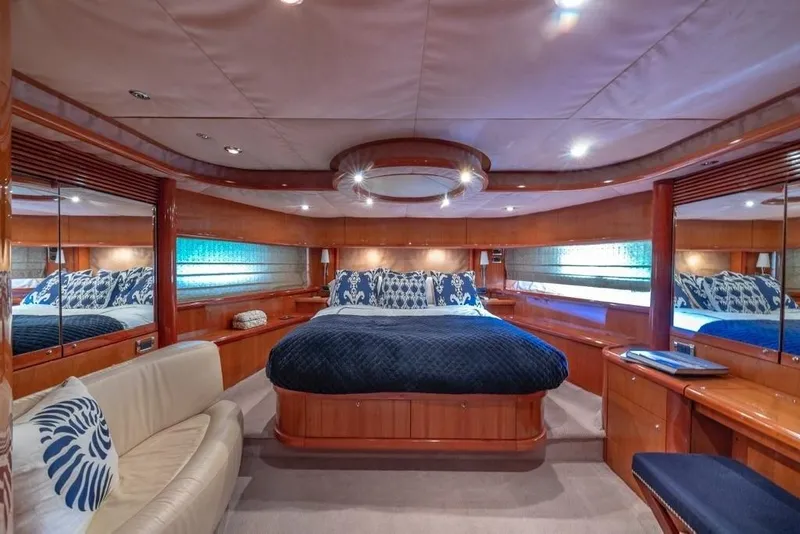 Slide: The Image of Luxurious bedroom interior of 2003 Sunseeker 82 Yacht with elegant wood finishes. - 12