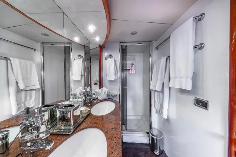 Slide: The Image of Luxurious bathroom in 2003 Sunseeker 82 Yacht with elegant fixtures and mirrored walls. - 13
