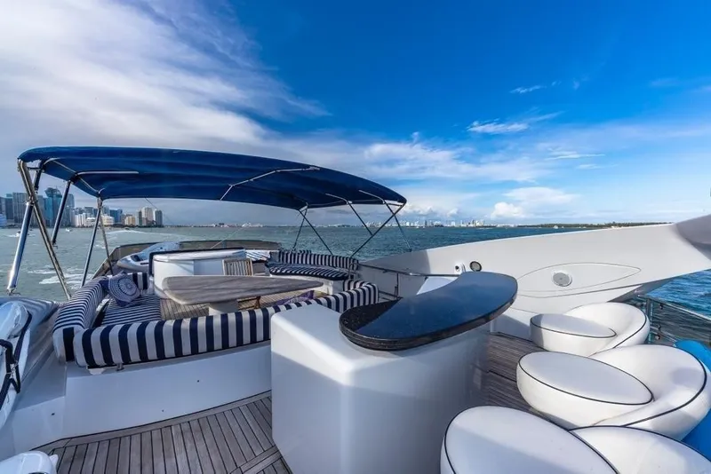 Slide: The Image of Luxurious 2003 Sunseeker 82 Yacht with elegant deck seating and ocean view. - 5