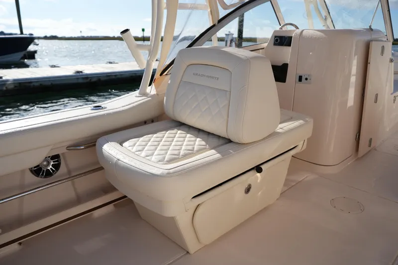 Slide: The Image of 2022 Grady-White Freedom 235 boat interior with luxurious seating and elegant design. - 19