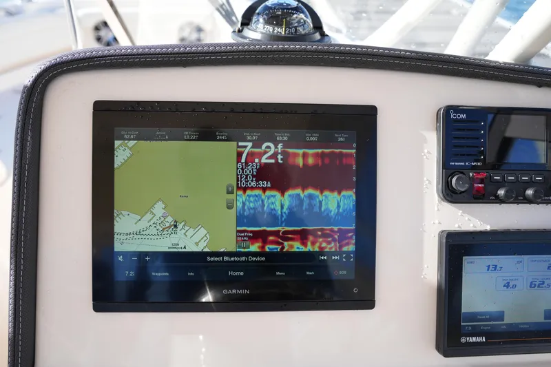 Slide: The Image of Garmin navigation display on 2022 Grady-White Freedom 235 boat dashboard. - 26