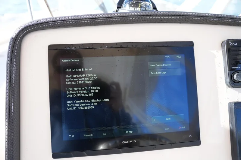 Slide: The Image of Garmin display on 2022 Grady-White Freedom 235 boat showing device information and settings. - 27