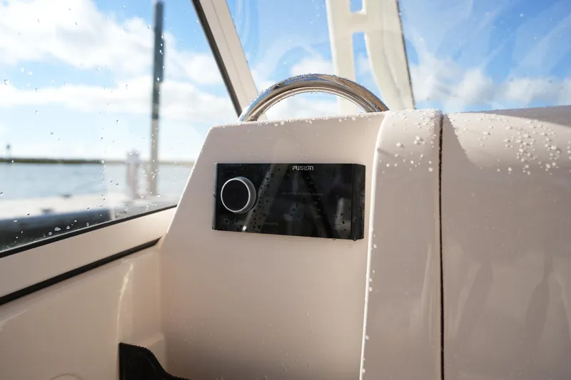 Slide: The Image of Grady-White Freedom 235 boat dashboard with Fusion audio system, 2022 model. - 34