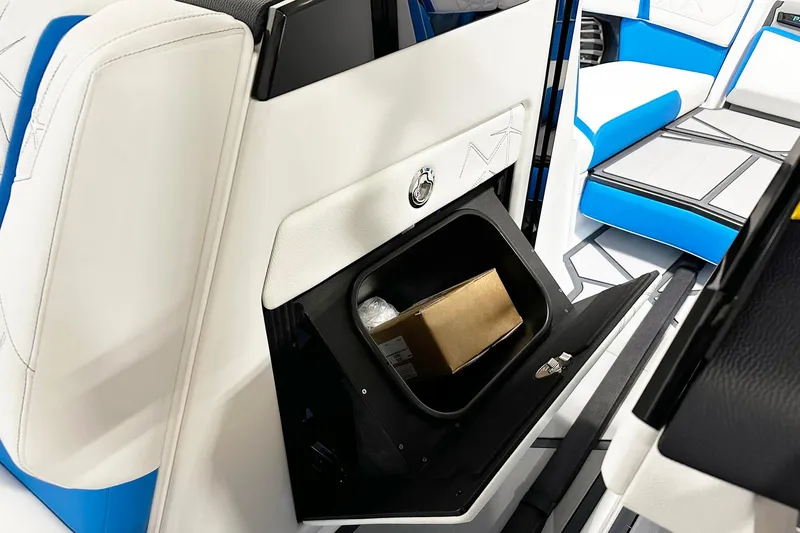 Slide: The Image of 2025 Nautique Super Air Nautique G23 Paragon interior storage compartment with sleek design. - 10