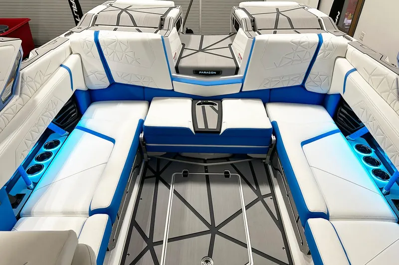 Slide: The Image of 2025 Nautique Super Air Nautique G23 Paragon interior with blue and white seating. - 11