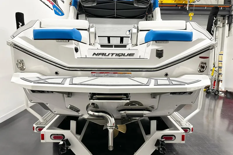 Slide: The Image of 2025 Nautique Super Air Nautique G23 Paragon boat rear view in showroom. - 3