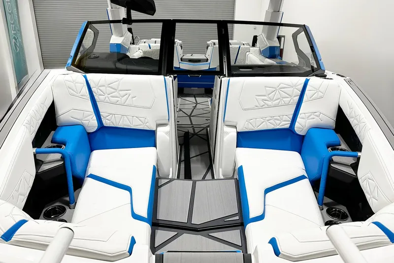 Slide: The Image of 2025 Nautique Super Air Nautique G23 Paragon interior with white and blue seating. - 4