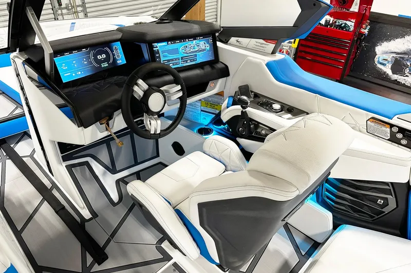 Slide: The Image of 2025 Nautique Super Air Nautique G23 Paragon cockpit with advanced digital displays and luxurious seating. - 5
