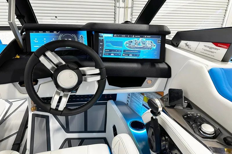 Slide: The Image of 2025 Nautique Super Air Nautique G23 Paragon cockpit with advanced digital displays and controls. - 6