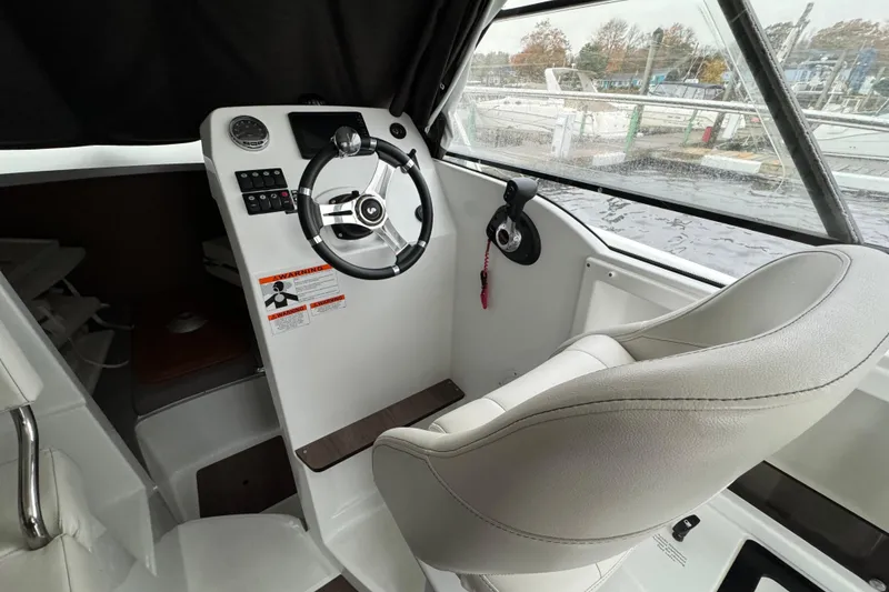 Slide: The Image of Interior helm of 2020 Beneteau Antares 8 boat with steering wheel and controls. - 11