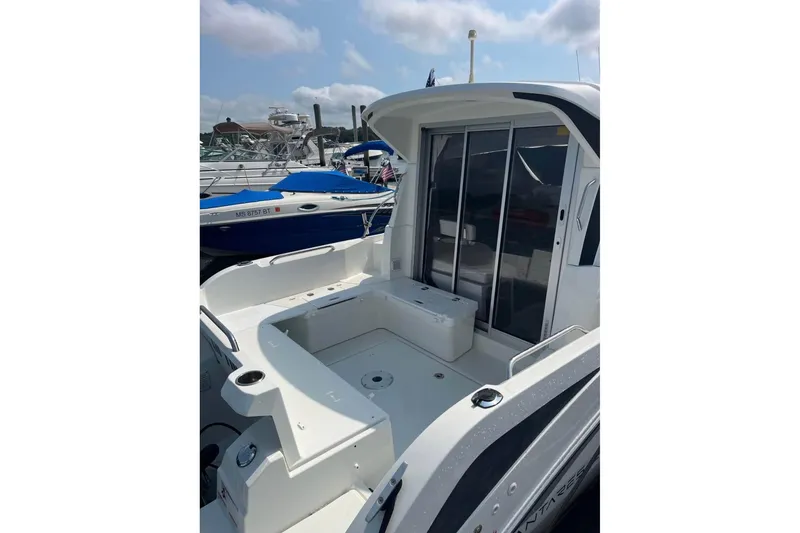 Slide: The Image of 2020 Beneteau Antares 8 boat with spacious deck and sliding glass doors. - 4