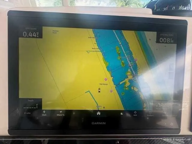 Slide: The Image of 2026 Grady-White 281 Coastal Explorer boat cockpit with advanced navigation systems. - 11