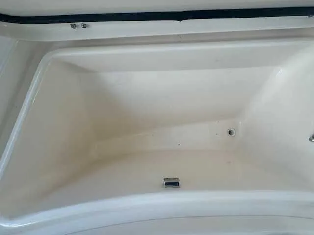 Slide: The Image of 2026 Grady-White 281 Coastal Explorer boat with cushioned seating and dual engines. - 23