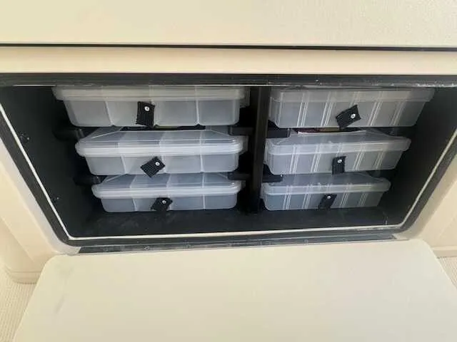 Slide: The Image of 2026 Grady-White 281 Coastal Explorer boat with open storage compartments. - 24