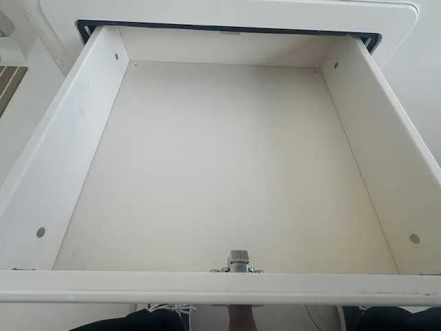 Slide: The Image of 2026 Grady-White 281 Coastal Explorer boat storage compartment with cushioned seat. - 25