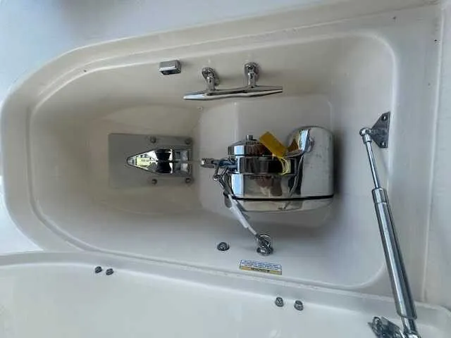 Slide: The Image of 2026 Grady-White 281 Coastal Explorer boat storage compartment with open lid. - 27