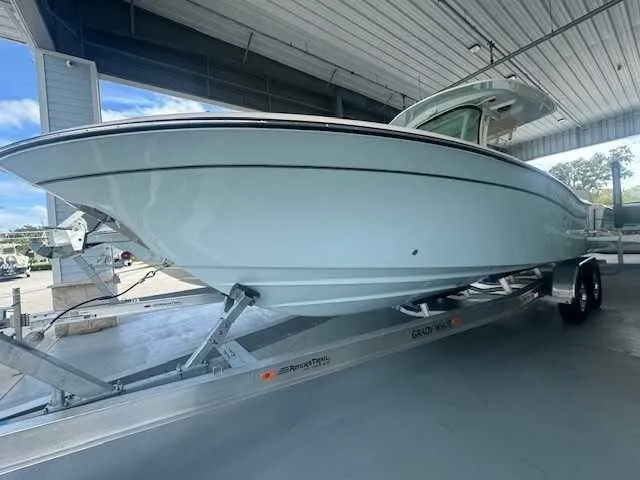 Slide: The Image of 2026 Grady-White 281 Coastal Explorer boat, aerial view, showcasing spacious deck and seating. - 3