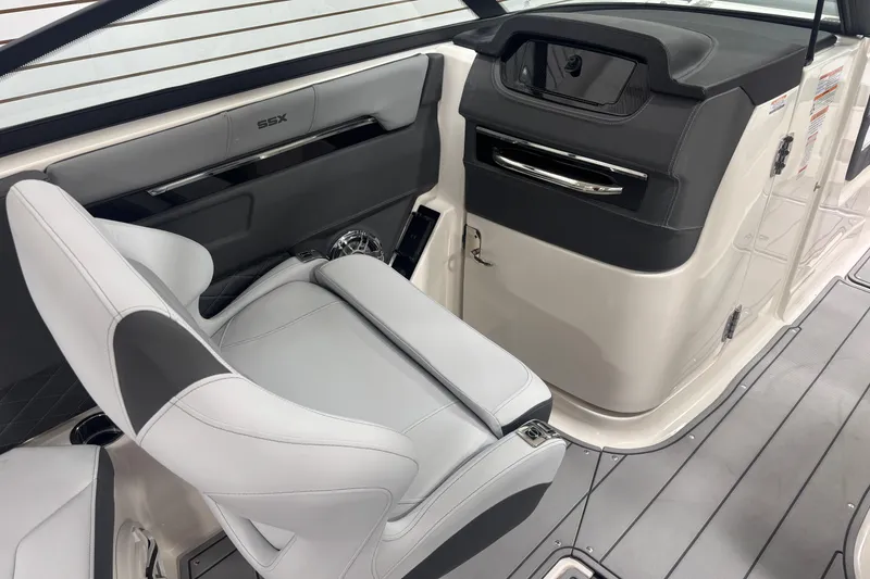 Slide: The Image of 2026 Chaparral SSX 30 boat interior with sleek seating and modern dashboard design. - 11