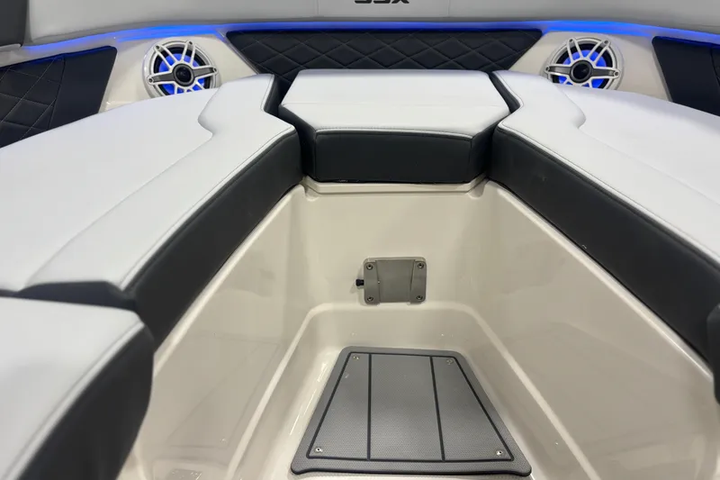 Slide: The Image of 2026 Chaparral SSX 30 boat interior with cushioned seating and built-in speakers. - 24