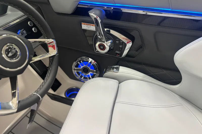 Slide: The Image of Interior of 2026 Chaparral SSX 30 boat, featuring steering wheel and control panel. - 27