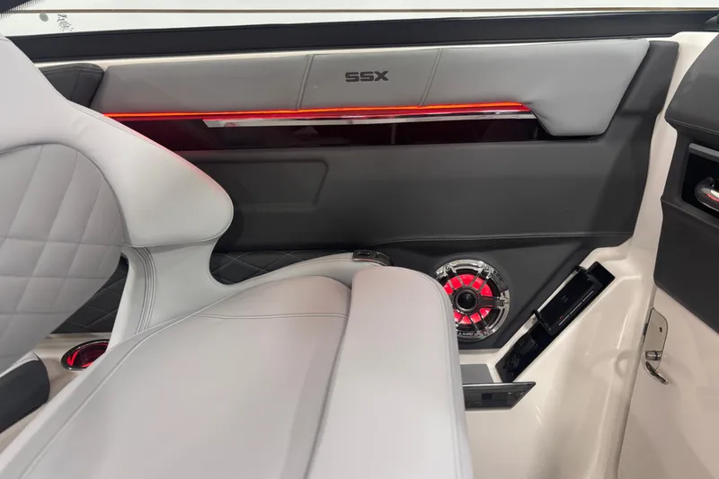 Slide: The Image of 2026 Chaparral SSX 30 interior with modern design, featuring sleek seating and illuminated speaker. - 28