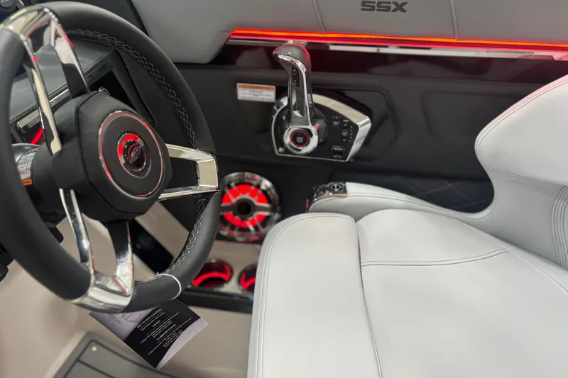 Slide: The Image of 2026 Chaparral SSX 30 boat interior with steering wheel and modern controls. - 30