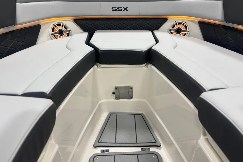 Slide: The Image of 2026 Chaparral SSX 30 boat interior with cushioned seating and speakers. - 31