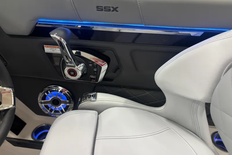 Slide: The Image of Interior of 2026 Chaparral SSX 30 boat with modern controls and blue LED lighting. - 34