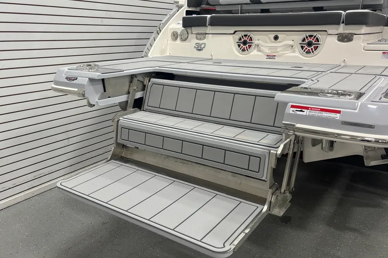 Slide: The Image of 2026 Chaparral SSX 30 boat swim platform with foldable steps and seating. - 36