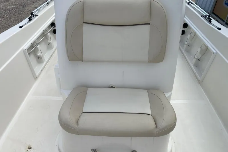 Slide: The Image of 2018 NauticStar 211 Coastal boat seat with beige and white upholstery. - 10