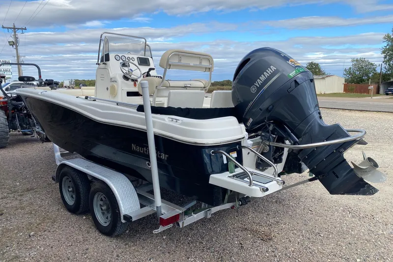 Slide: The Image of 2018 NauticStar 211 Coastal boat on trailer with Yamaha outboard motor. - 4