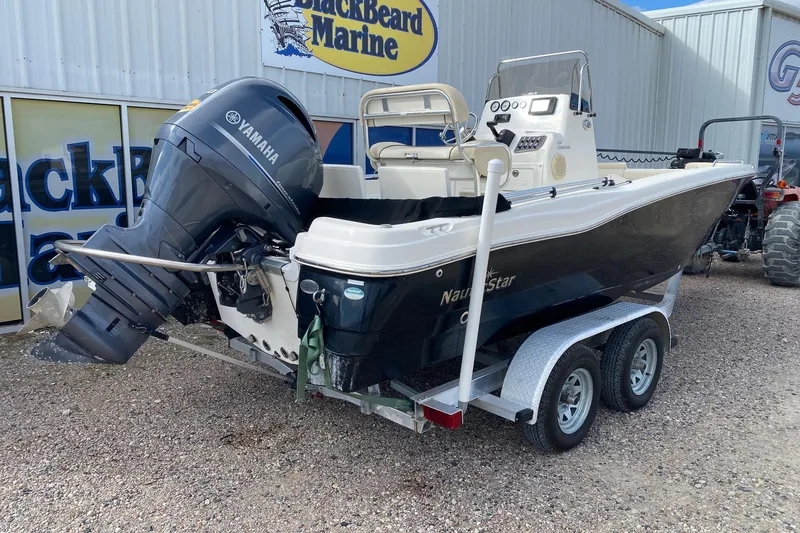 Slide: The Image of 2018 NauticStar 211 Coastal boat with Yamaha engine on trailer at BlackBeard Marine. - 6