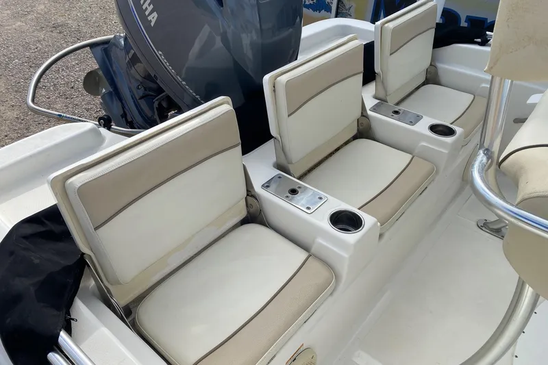 Slide: The Image of 2018 NauticStar 211 Coastal boat seats with cup holders and Yamaha engine. - 8