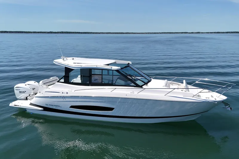 The Image of 2025 Regal 36 XO boat on calm water, showcasing sleek design and modern features. - 0