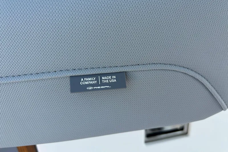 Slide: The Image of 2025 Regal 36 XO boat interior, featuring a "Made in the USA" label. - 33