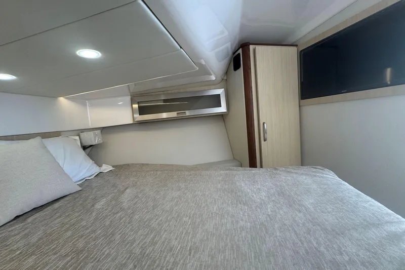 Slide: The Image of Luxurious cabin interior of 2025 Regal 36 XO yacht with modern amenities. - 34