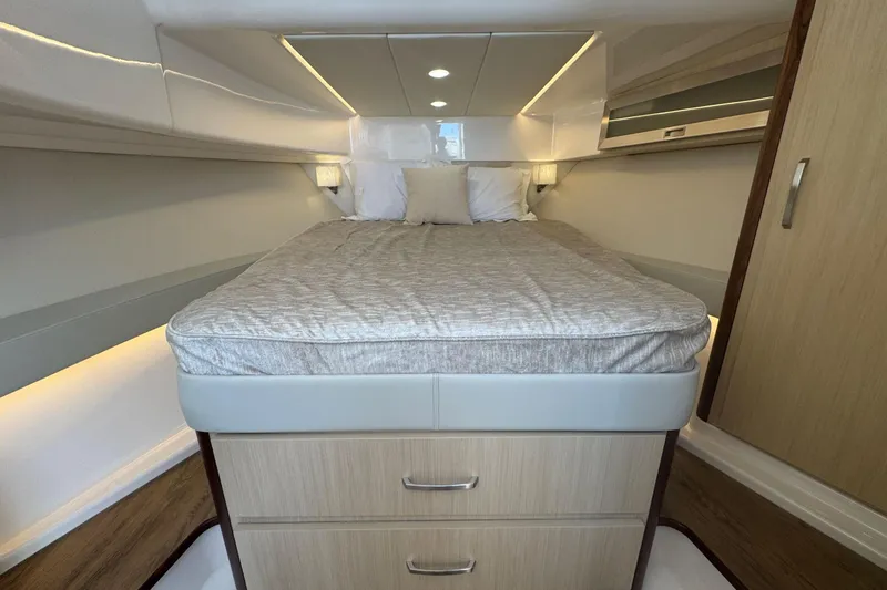 Slide: The Image of Luxurious cabin interior of 2025 Regal 36 XO yacht with cozy bed and modern design. - 39