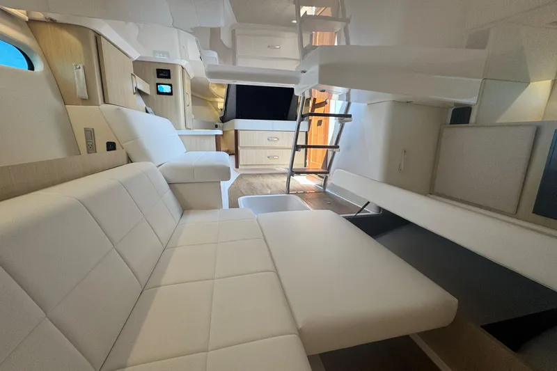 Slide: The Image of Luxurious interior of 2025 Regal 36 XO yacht with modern seating and cabinetry. - 45