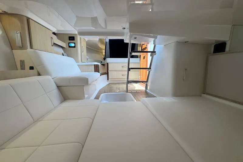 Slide: The Image of Luxurious interior of 2025 Regal 36 XO yacht with modern seating and sleek design. - 46