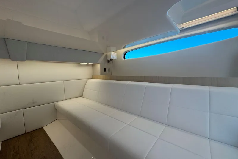Slide: The Image of Luxurious interior of 2025 Regal 36 XO yacht with white seating and modern design. - 49
