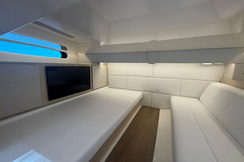 Slide: The Image of Luxurious interior of 2025 Regal 36 XO yacht with modern seating and TV. - 55