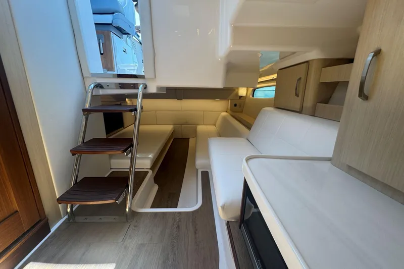 Slide: The Image of Luxurious interior of 2025 Regal 36 XO yacht with modern seating and wooden accents. - 57