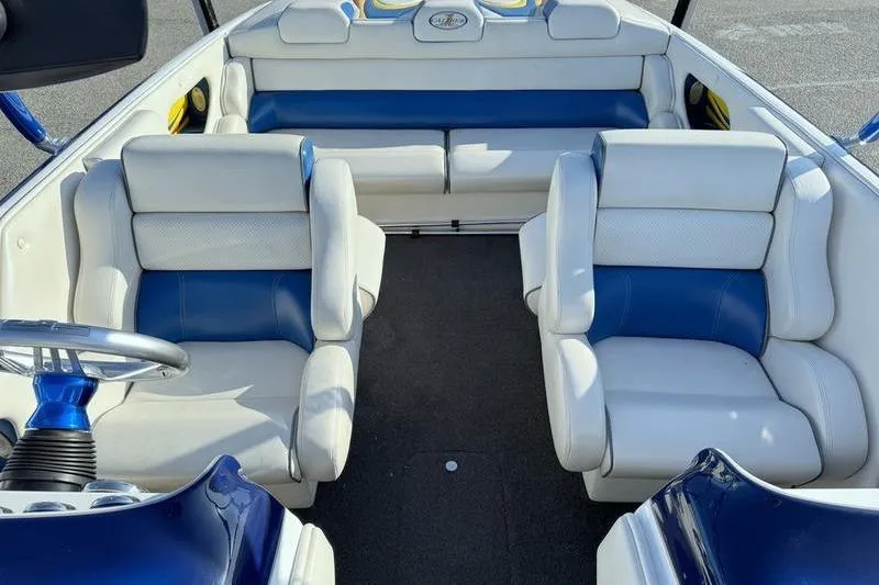 Slide: The Image of Interior of 2013 Caliber 1 230 Velocity boat with blue and white seating. - 12